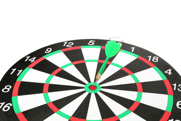 Dart board with green arrow on white background