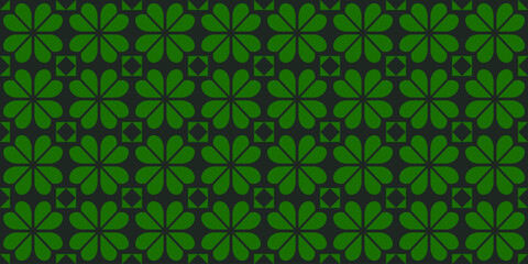 Seamless pattern with abstract green clover leaves on a dark background. Perfect for St. Patrick's Day designs and decorations. High resolution vector for fabric, textiles, wrapping paper, etc.