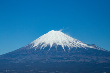 Landscape of Japan Mt. Fuji volcano in winter with a clear blue sky.