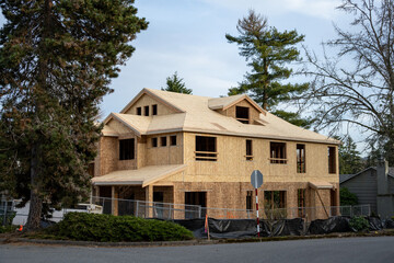 New home construction, wood frame and plywood OSB oriented strand board exterior walls, winter...