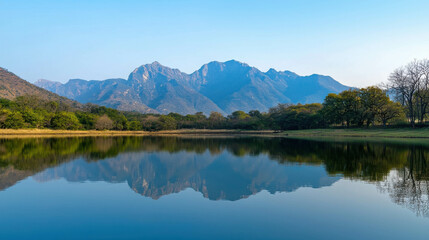 Fototapeta premium Serene Lakeside Sanctuary with Crystal Clear Waters and Majestic Mountain Reflections