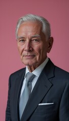 plain pink background Caucasian elderly guy in formal suit whole body portrait