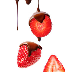 Creative layout made of bar of dark  chocolate and strawberry on the white background. Flat lay. Food concept.  Melted chocolate on the strawberry on the white.