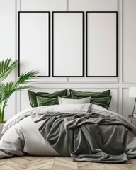 Three black framed empty posters hang above a bed with white sheets and green pillows. all in a minimalist bedroom with a parquet floor