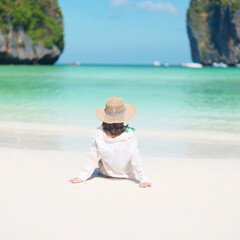 Woman tourist traveling and sightseeing in Krabi, Thailand, happy traveller enjoy at Maya Bay beach...