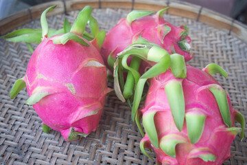 pink dragon fruit on wooden background