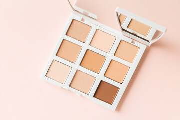Beauty palette application studio makeup product soft lighting close-up aesthetic trends