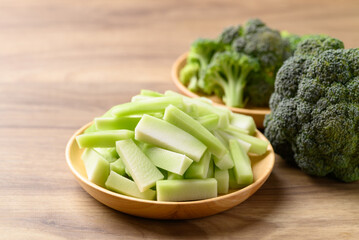 Chopped broccoli stem in wooden plate prepare for cooking, Organic vegetables, Healthy food ingredient