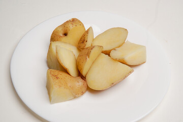 Homemade boiled potatoes on top of a plate for healthy diet and vegetarian menu.