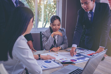 Business peoples meeting to discuss the situation on business plan, marketing for investment. Selected focu