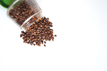 Coffee beans on a glass jar isolated on a white background