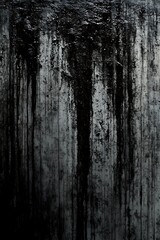 Monochrome wall with dense black drips and textured surface design