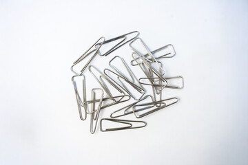 Fototapeta premium Isolated grey papper clips on a white background