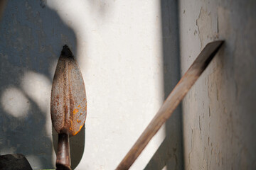 An old rusty trowel with light makes it dramatic.