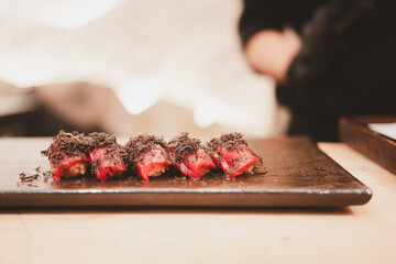 Tuna sushi with truffle on a stone plate. Japanese traditional and luxury meal