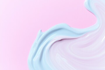 swirls of creamy vibrant cosmetic textures blend together on plain pastel background with ample copy space