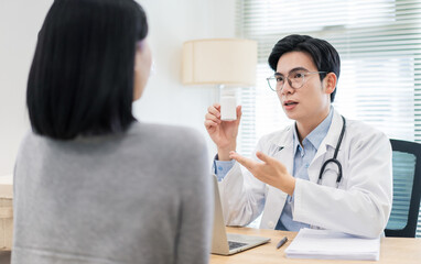 Consultation between doctor and patient in a modern clinic setting, discussing health concerns and...