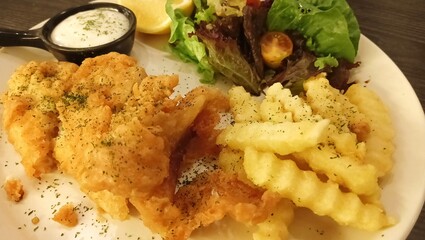chicken and potatoes, and salad on plate. Western set menu.