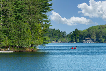 Lake Joseph in Muskoka, Ontario, Canada. A clear summer day with blue water stretching to a...