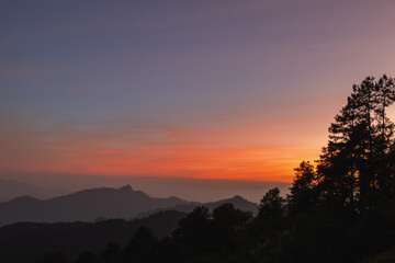 Heaven at early morning with copy space. Smooth orange blue gradient of dawn sky.Sunset, sunrise backdrop.Natural colors. Orange and red dramatic colors.