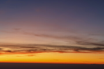 Heaven at early morning with copy space. Smooth orange blue gradient of dawn sky.Sunset, sunrise backdrop.Natural colors. Orange and red dramatic colors.