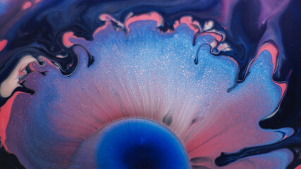 Acrylic pigment. Fluid art. Defocused pink crimson blue colorful enamel drop gel paint in water floating on abstract chemical background.