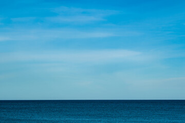 Nature of the beach and sea Summer with sunshine, sandy beaches, clear blue waters sparkling against the blue sky. On an island with good ecology and environment Background for summer vacation