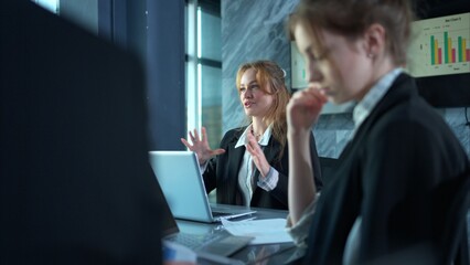 In the conference room, a group of businesspeople are discussing the follow-up meeting and the results of operations