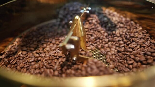 View in close up of coffee beans being cooled in a coffee toaster