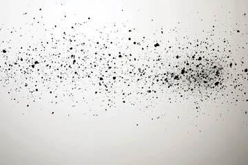 Black particles falling on a white background