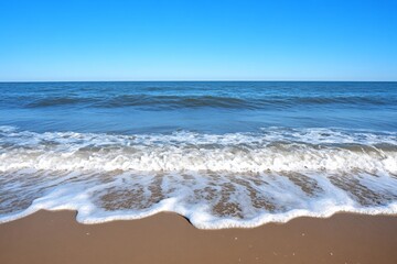 A tropical beach with visible rip currents, creating unique wave patterns
