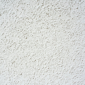 White textured wall, pebble-dash finish