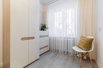 Cozy Minimalist Corner with White Furniture and Plant