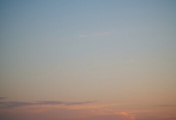 Dreamy Twilight Sky. Pastel Colors, Soft Light. A Beautiful Blend Of Blue, Pink And Orange Shades Creating Serenity. Wispy Clouds Add Depth. Tranquil Nature Scene For Reflection.
