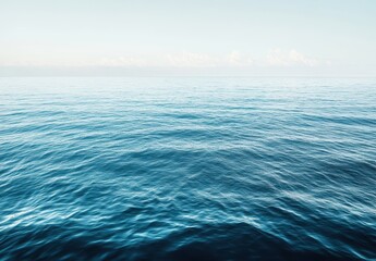 Obraz premium Tranquil Seascape with Gentle Waves Under Cloudless Sky Captured in Soft Light for Serenity and Calmness Purposeful Background