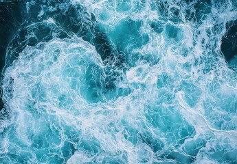 Naklejka premium Turbulent Ocean Waves Creating Intricate Patterns in Shades of Blue and White, Capturing the Beauty of Nature's Dynamic Water Movements