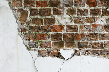 Cracked and Damaged Brick Wall Texture with Exposed Red Bricks and White Plaster