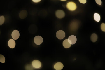 Abstract Bokeh Lights in Dark Background - Blurred Twinkling Circles for Festive and Artistic Designs