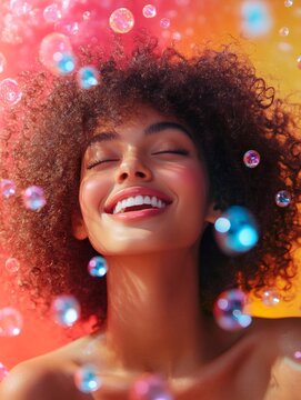 Happy model smiling with soap bubbles and afro hair