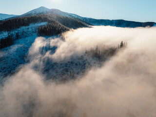 Winter hiking to Sina in Low Tatras National park near jasna is full of beautiful views. Sunset in Slovakia mountains with Chopok peak.