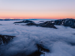 Obraz premium Winter hiking to Sina in Low Tatras National park near jasna is full of beautiful views. Sunset in Slovakia mountains with Chopok peak.