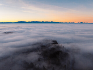 Obraz premium Misty morning in Liptov region with High Tatras mountains around. Liptovsky Mikulas landspace, slovakia.