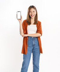 Beautiful Asian woman holding smartphone mockup of blank screen and smiling on white background.