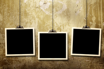 Photos hanging on paper clips against wall. Nostalgic Picture album with old photoframe. Template with three retro frame photos. Moodboard pictures album for scrapbooking. Vintage style mood board