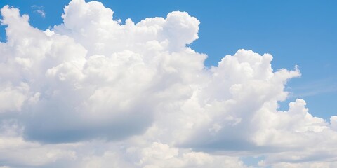 Obraz premium White fluffy clouds floating in a clear blue sky on a sunny summer day, peaceful, blue sky