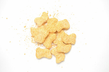 Top view pile of beef nuggets isolated on white background.Copy space for text.Fast food industry concept.Beef nuggets.For graphic design,3D rendering or banner background