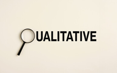 Magnifying glass focusing on qualitative research and analysis