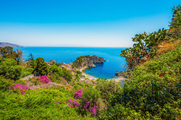 Isola Bella is small island near Taormina, Sicily, Italy.  Beach in azure waters of Ionian Sea.