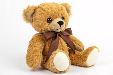Obraz premium Cute brown teddy bear with ribbon sitting on white background, soft plush toy for children