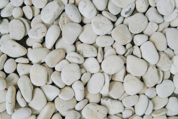 Pile of gray stones and pebbles texture pattern for background.